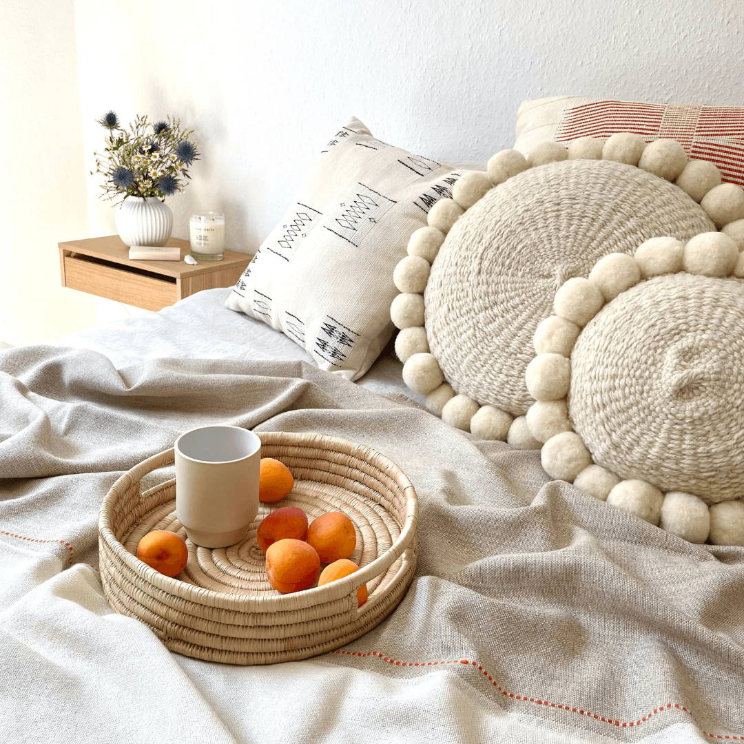 Mood picture with alpaca blanket Asiri and Salta pom pom cushion - By Native