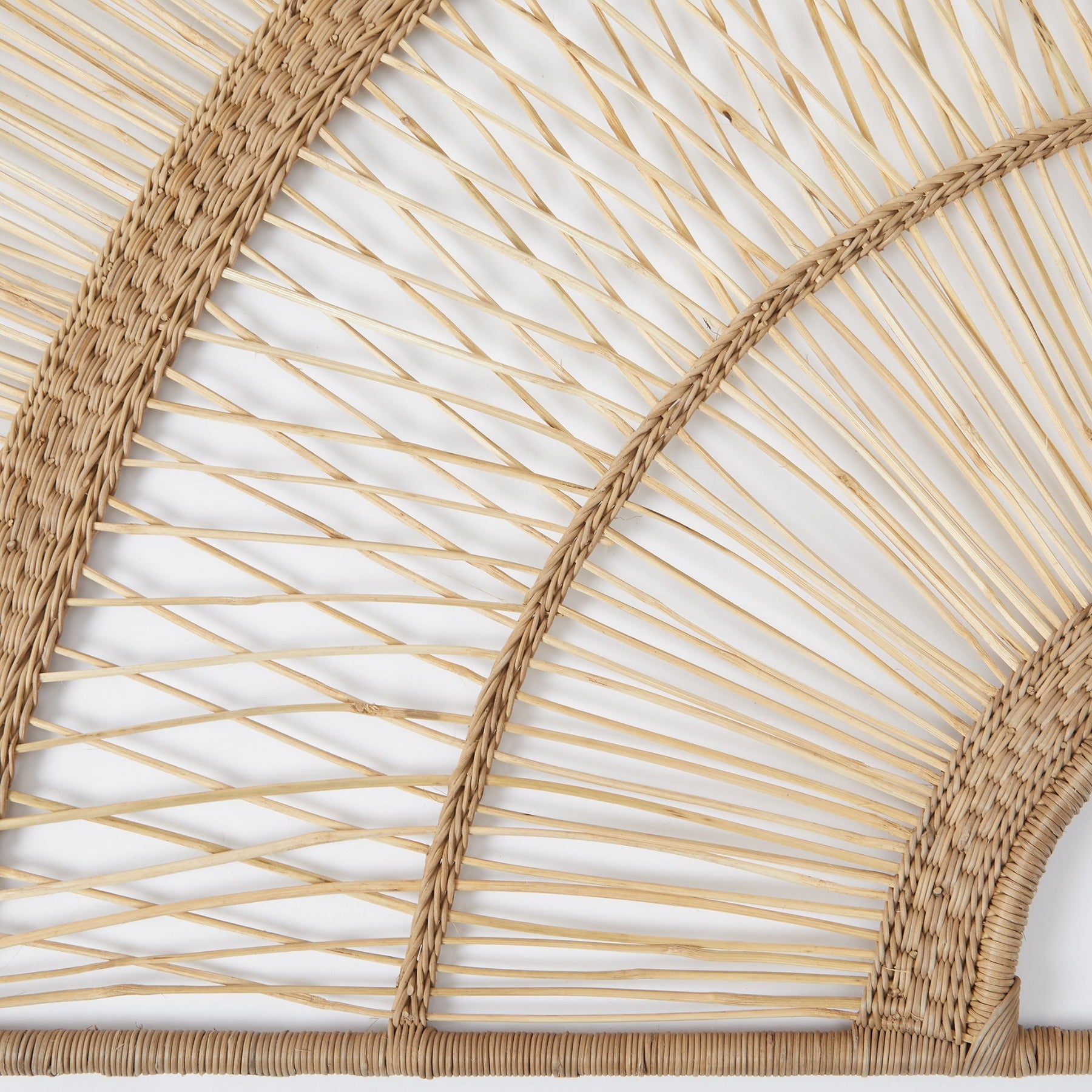 Detail Lugono bed headboard woven from rattan. 