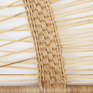 Detail view Lugono bed headboard woven from rattan. 