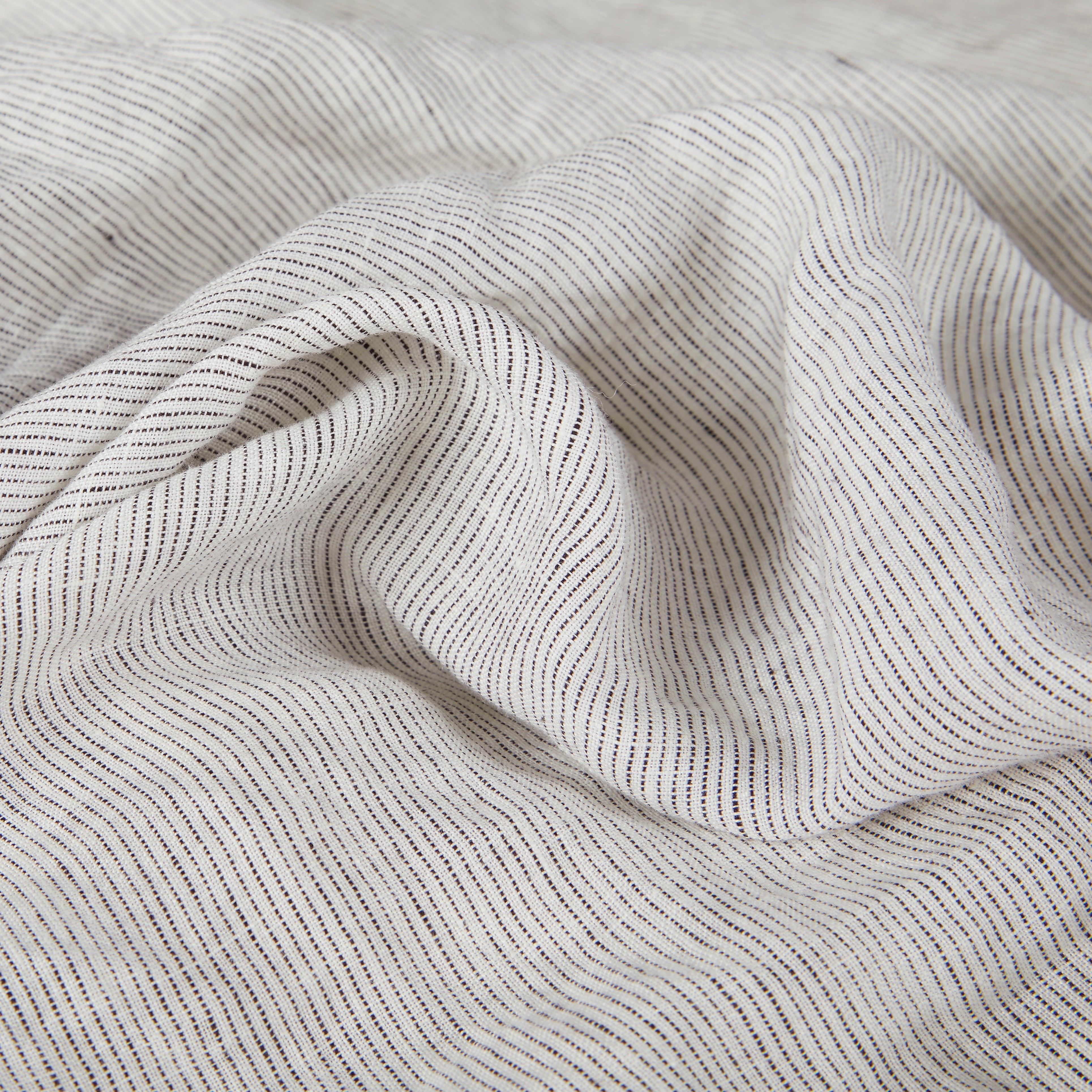 Fabric pattern stonewashed linen in gray and white.