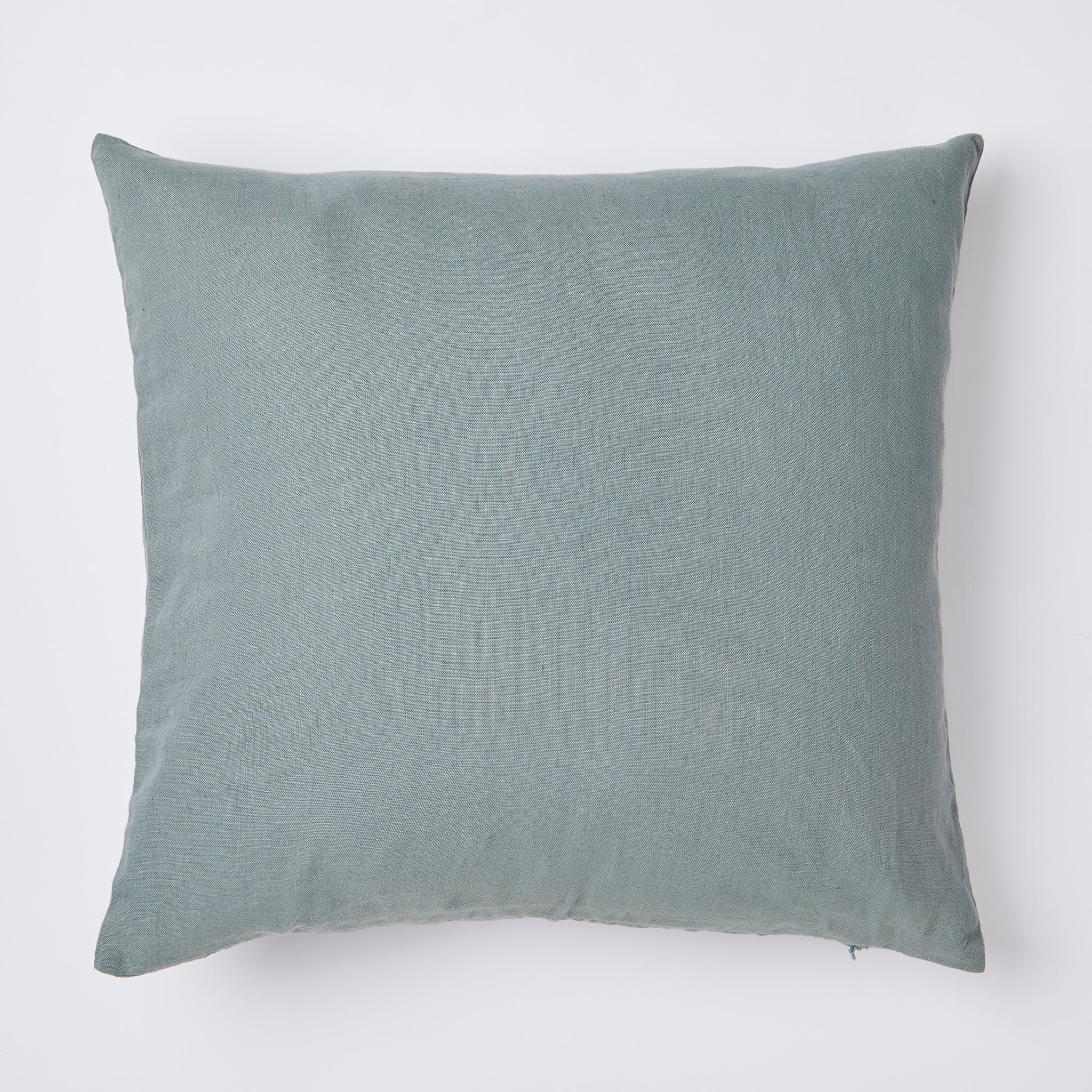 Linen cushion in mineral blue.