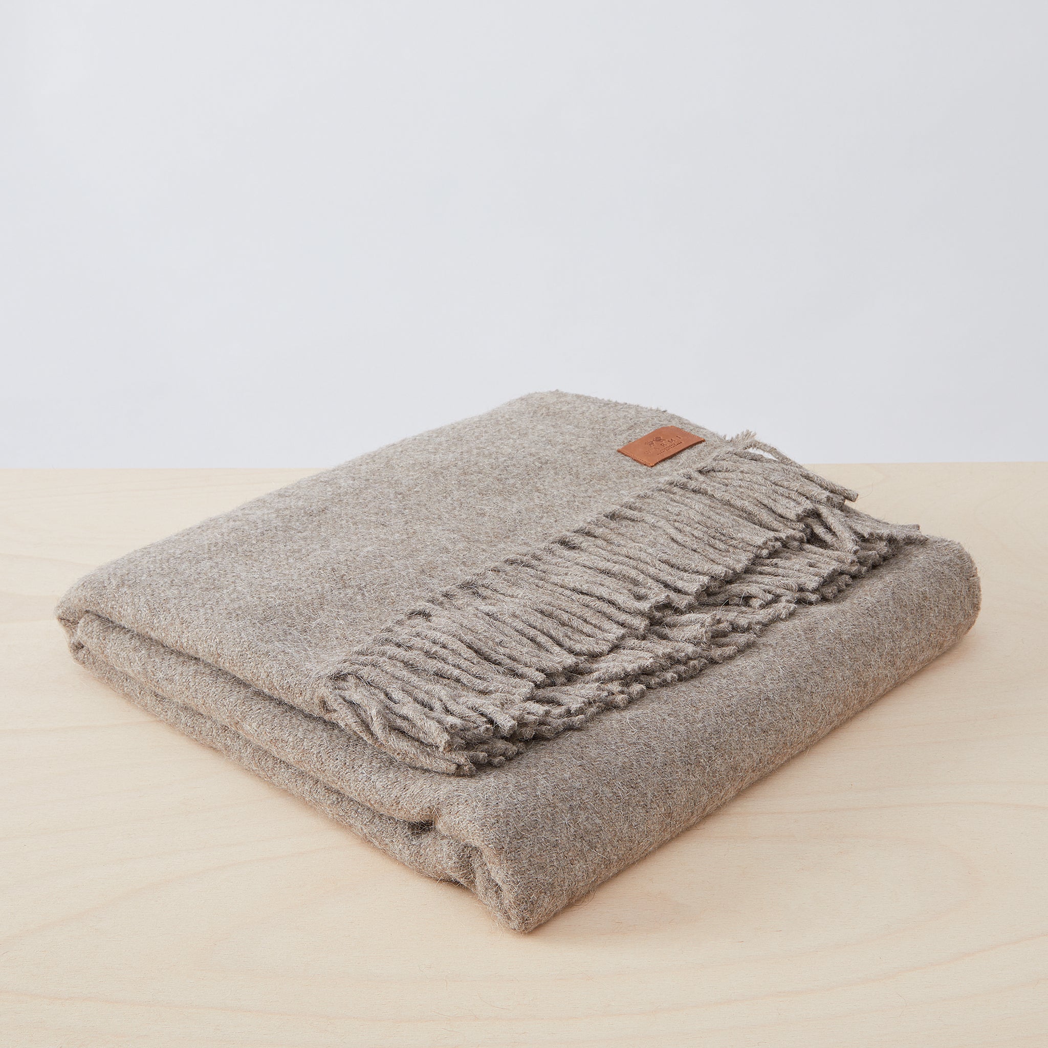 Llama blanket from By Native in taupe.