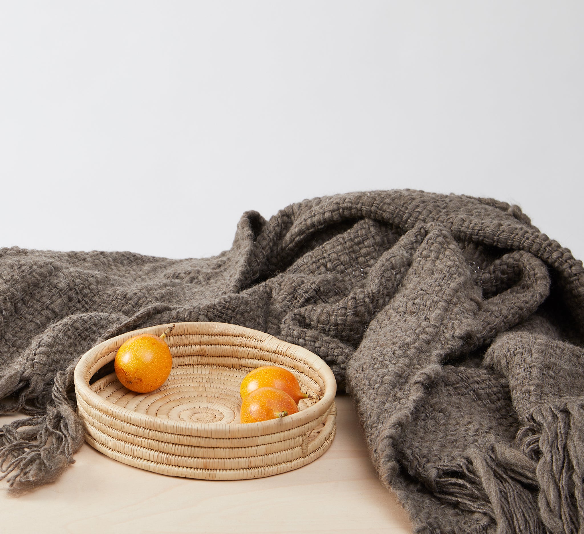Handwoven Merino wool blanket Sueño in detail with tray "Umi". Shop online now at By Native.
