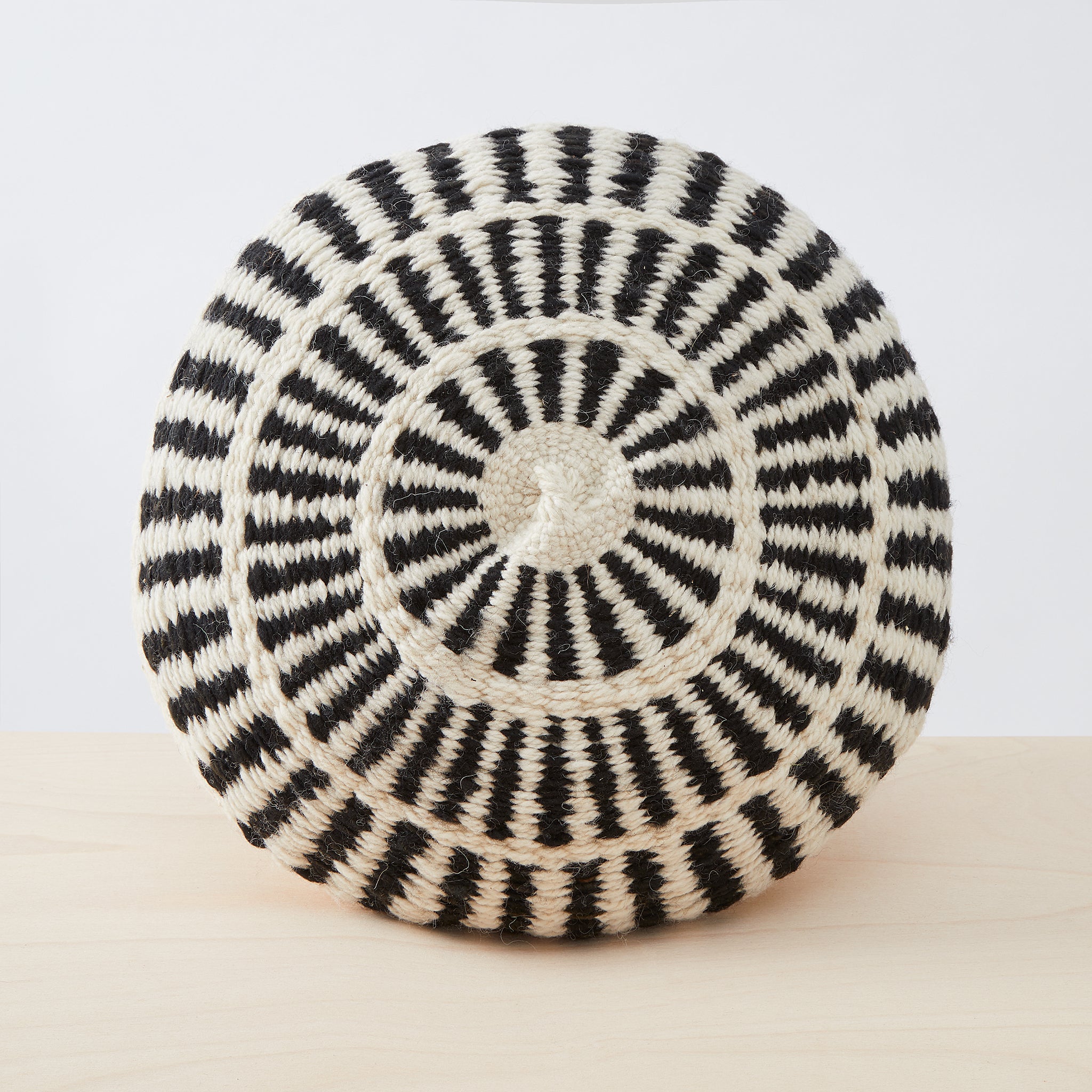 A great eye-catcher on your sofa or in your favourite armchair. Individual, lovingly handmade cushion made from 100% Argentinian sheep's wool with a traditional pattern in natural white & black.