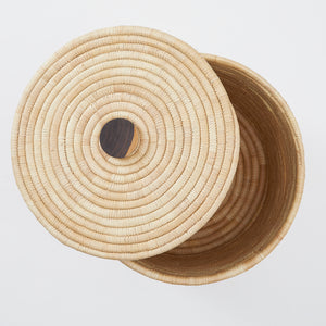 Top view detail laundry basket with lid and mahogany handle. Carefully and sustainably woven by hand in Malawi. By Bative