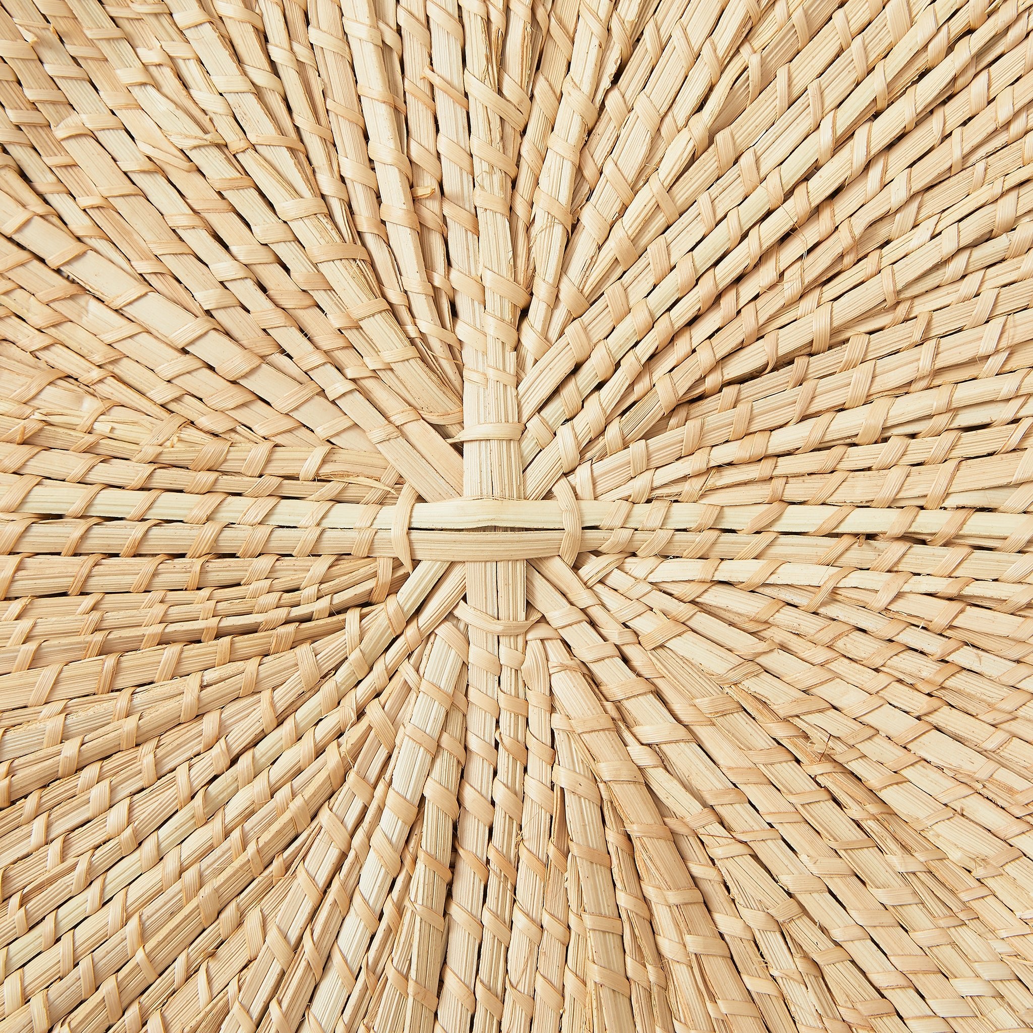 Detail view. BY NATIVE Wall decoration "Sun plate", size S hand-woven from palm fibres.